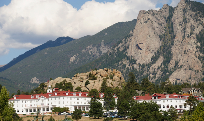 Historic haunted hotel with red roofs nestled in the mountains, a top haunted place known for dark secrets and nightly screams. Historic haunted hotel with red roofs nestled in the mountains, a top haunted place known for dark secrets and nightly screams.