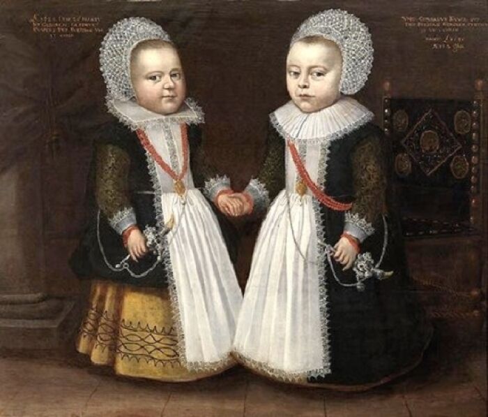 Two children in medieval attire holding hands, showcasing classic elements for meme captions and punchlines.