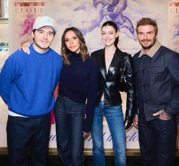 Brooklyn Beckham with family posing casually at event, highlighting self-proclaimed chef and breakfast video controversy.
