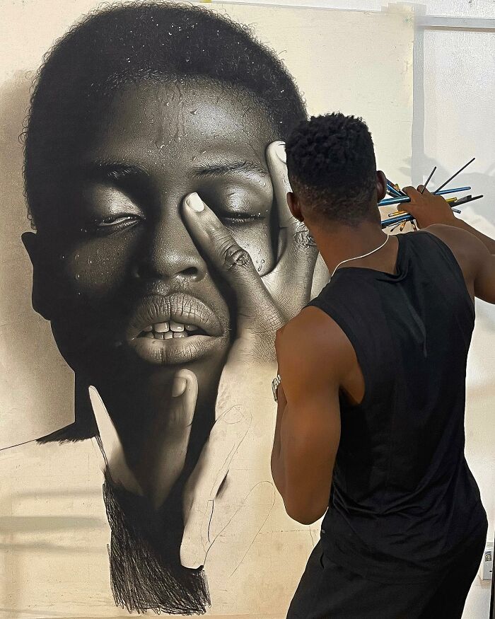 Artist creating a hyperrealistic portrait using colored pencils, showing detailed behind-the-scenes art process.