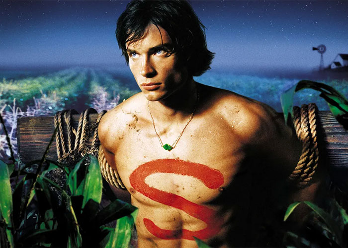 Young 2000s teen heartthrob with shirtless torso and red S painted, tied to wooden post in a cornfield at night. Young 2000s teen heartthrob with shirtless torso and red S painted, tied to wooden post in a cornfield at night.