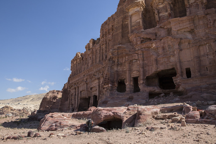 Ancient Petra rock-cut facades in Jordan with donkey, illustrating Most Stressful Countries