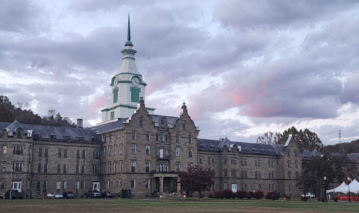 Historic eerie building under dark clouds, one of the most haunted places in America known for nightly screams and dark secrets. Historic eerie building under dark clouds, one of the most haunted places in America known for nightly screams and dark secrets.