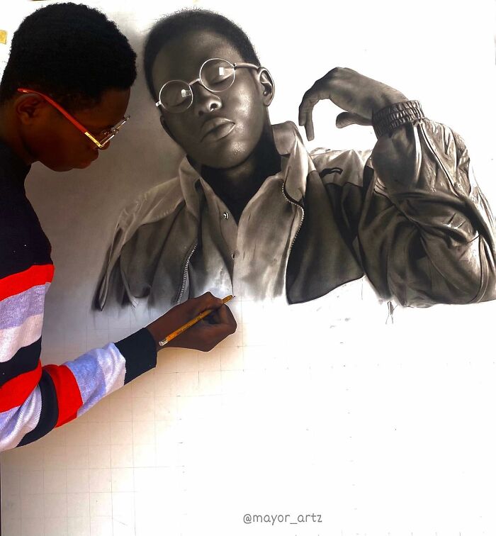 Artist creating a hyperrealistic portrait with detailed shading and textures in a behind-the-scenes drawing session.