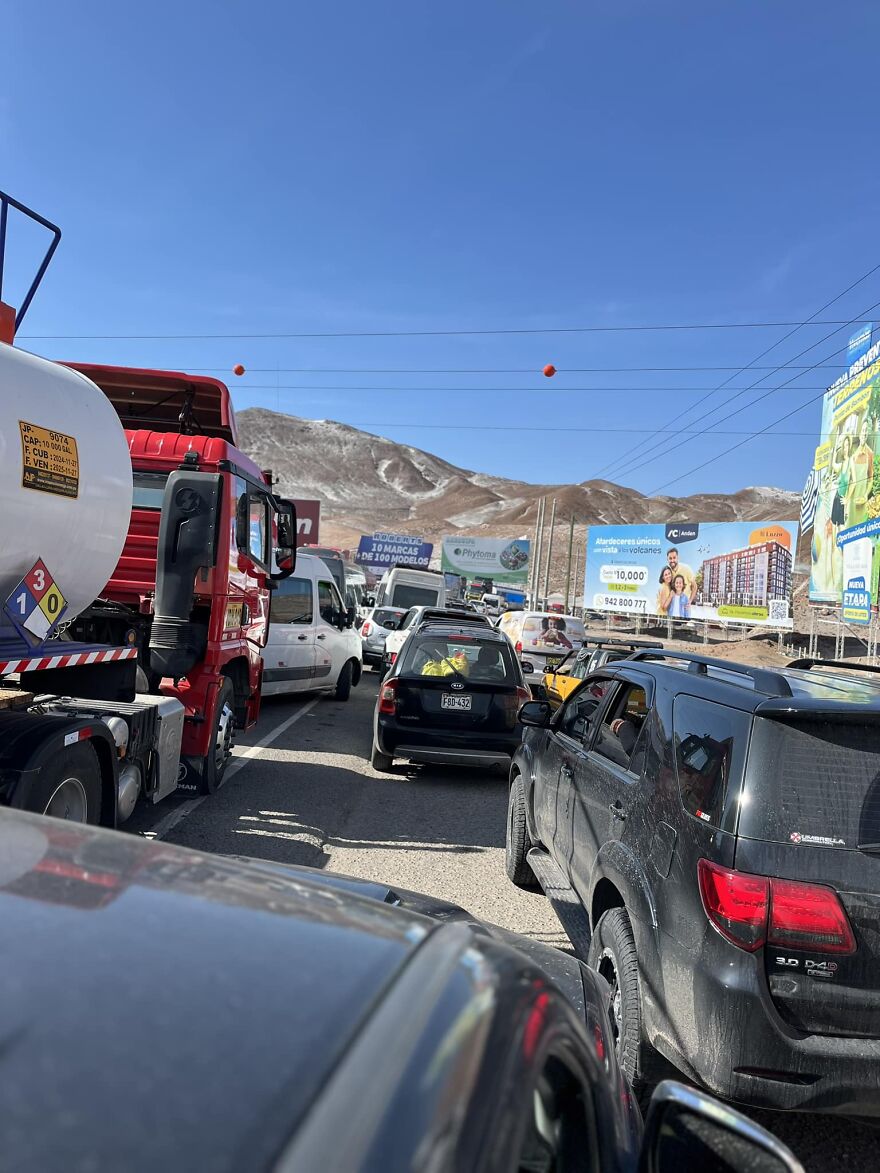Traffic jam with cars and trucks on a mountain road illustrating cities with the worst traffic in the world and congestion.