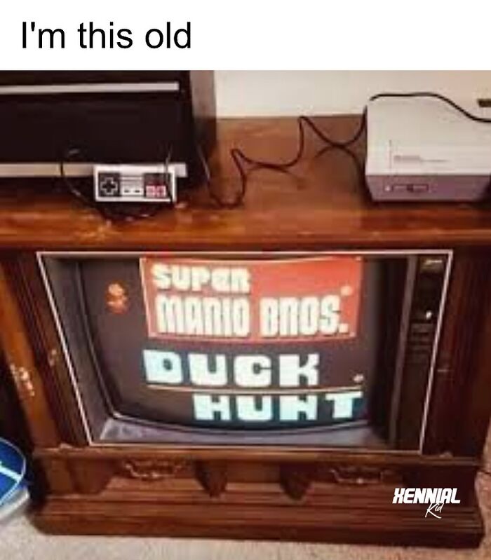 Retro TV set showing Super Mario Bros and Duck Hunt game, vintage Nintendo console and controller for Xenials nostalgic trip.