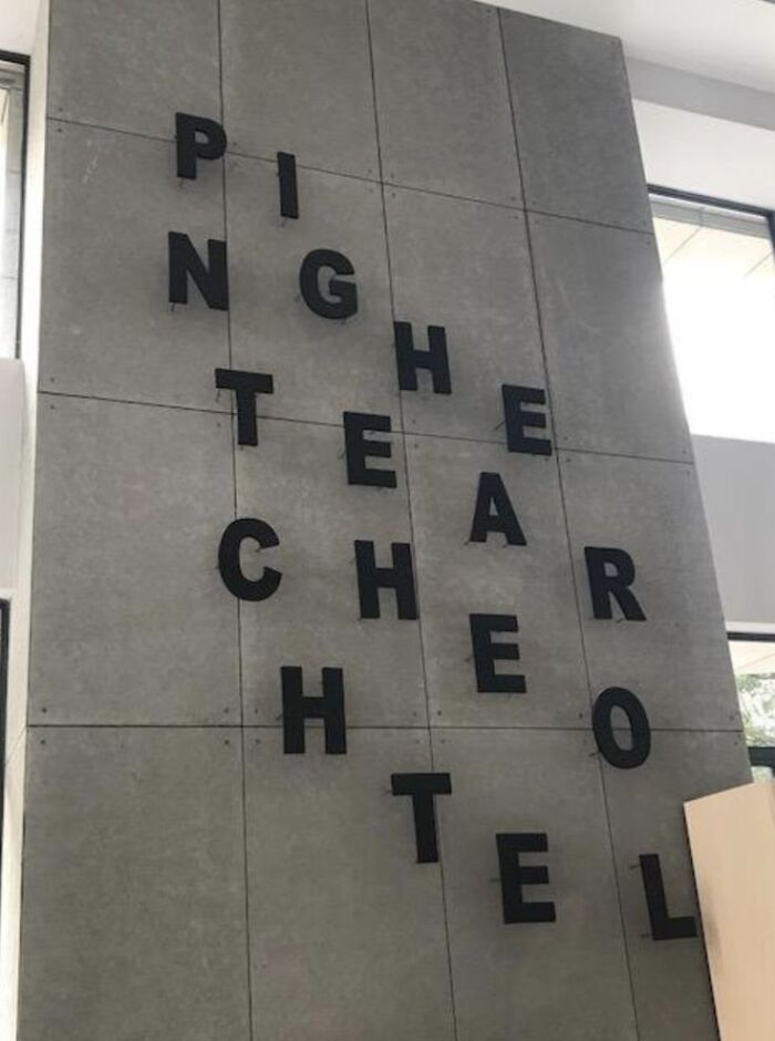 Black letters arranged confusingly on a wall, challenging readers to understand what they’d read and breaking brains.