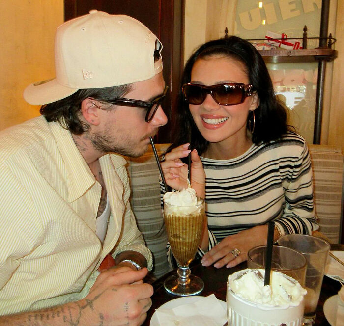 Brooklyn Beckham enjoying a whipped cream topped breakfast drink amid family feud and laughable chef criticism. Brooklyn Beckham enjoying a whipped cream topped breakfast drink amid family feud and laughable chef criticism.