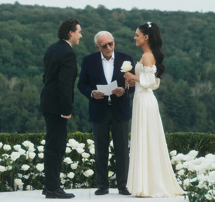 Brooklyn Beckham at wedding ceremony with Nicola Peltz, background sparking theories amid family controversy. Brooklyn Beckham at wedding ceremony with Nicola Peltz, background sparking theories amid family controversy.