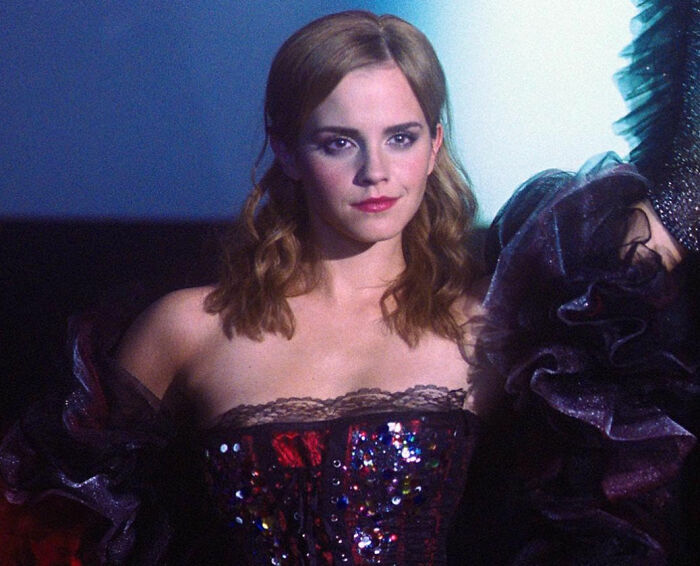 Actress in a sequined dress on a movie set, representing diva stars shared by movie set workers.