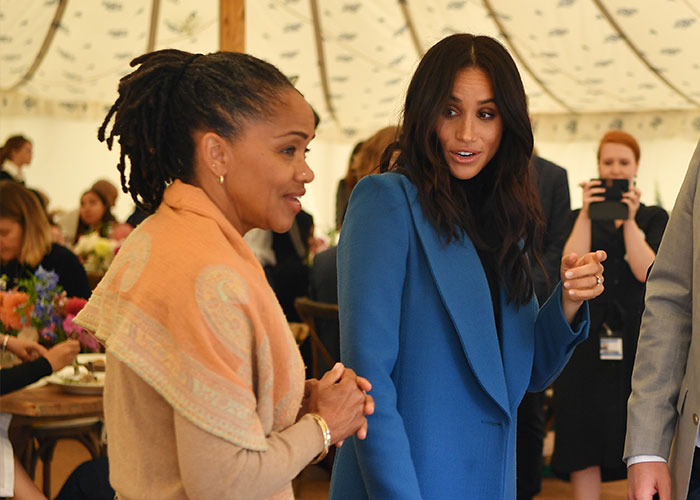 Meghan Markle and her mother Doria engaged in conversation at a public event amid alleged rift theories.
