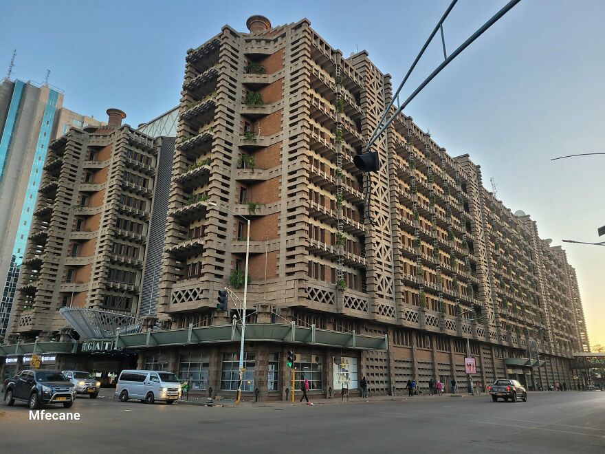 Large building with natural ventilation design, showcasing biomimicry examples in architecture inspired by nature principles.