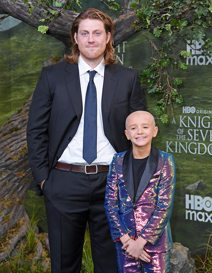 Peter Claffey and child star Dexter Sol Ansell posing together at an event, highlighting height difference humor.
