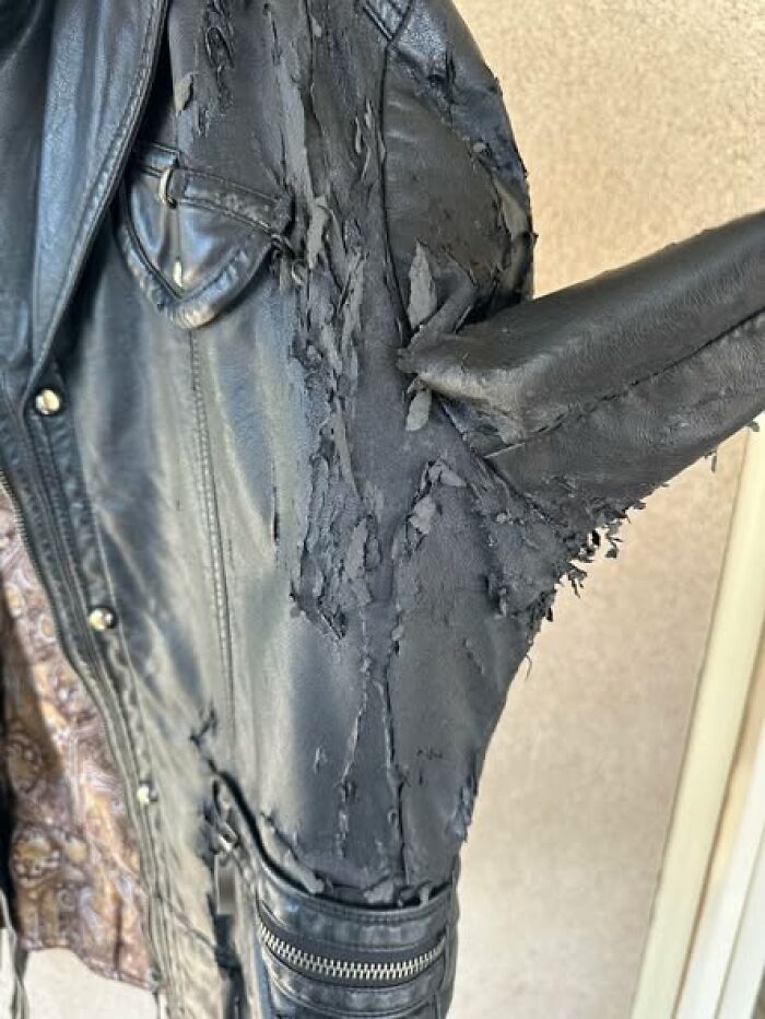 Woke up expecting a normal day: black leather jacket peeling and shredded at the armpit, zipper pocket visible