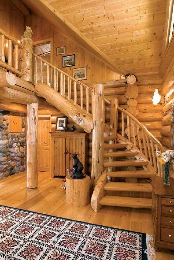 Rustic wooden staircase and log beam interior showcasing beautifully crafted woodworking projects in a cozy cabin setting.
