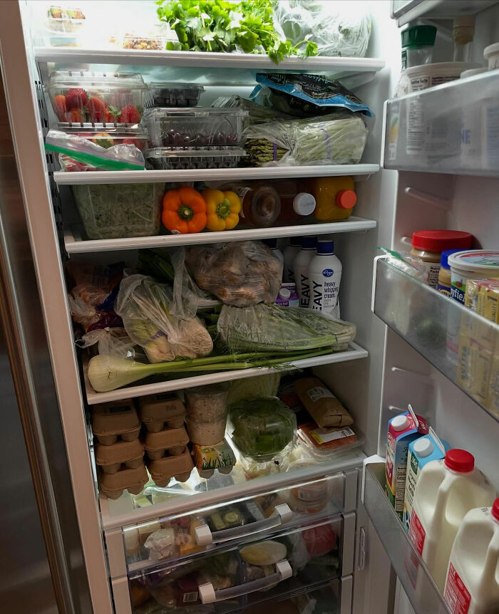 Open fridge filled with fresh produce and groceries during Melissa Gilbert sparks outrage Instagram fridge tour controversy.