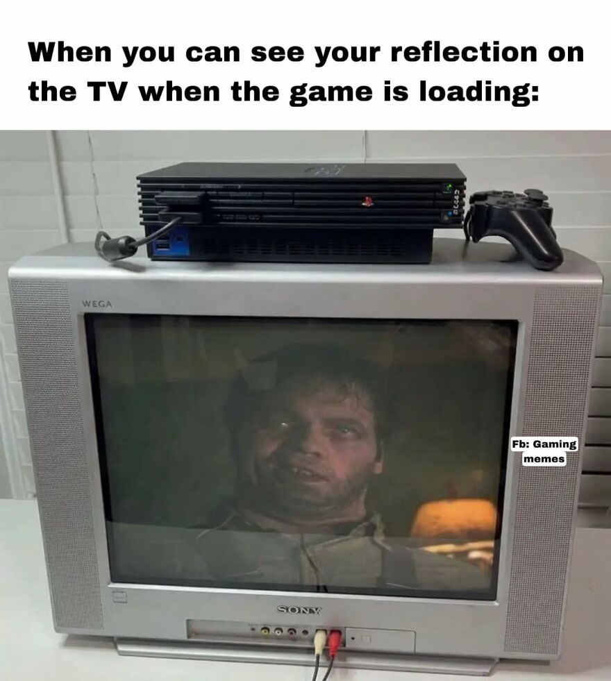 Old Sony TV with PlayStation console and controller on top, showing a reflection while video game is loading, relatable gaming meme.