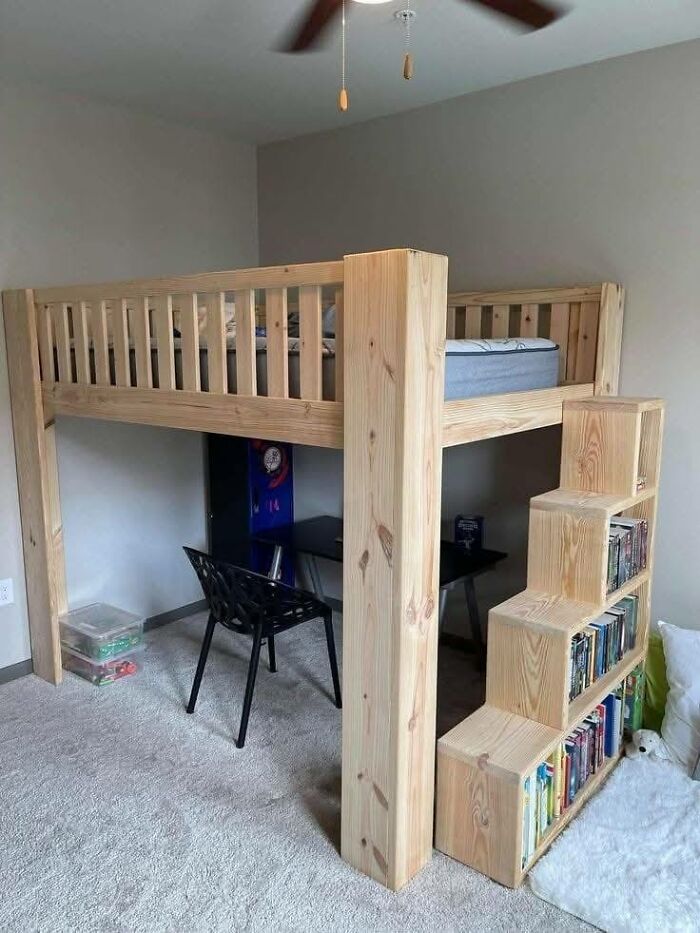 Loft bed woodworking project with built-in bookshelf stairs crafted from natural wood in a minimalist bedroom setting.