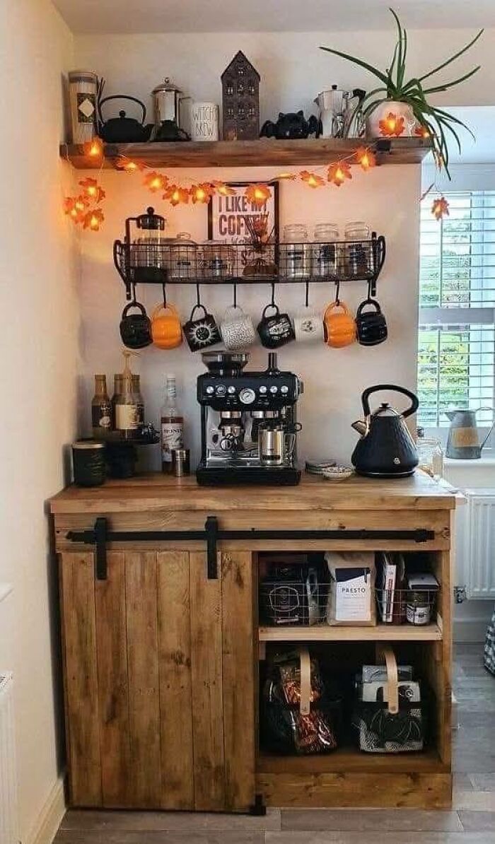 Rustic coffee station with beautifully crafted woodworking projects featuring a wooden cabinet and shelving with mugs and accessories.