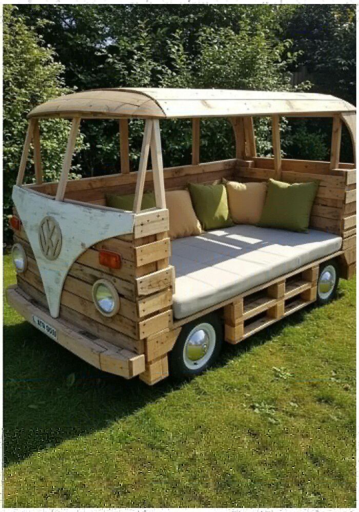 Wooden outdoor bench crafted to look like a vintage van with cushions, showcasing impressive woodworking projects.