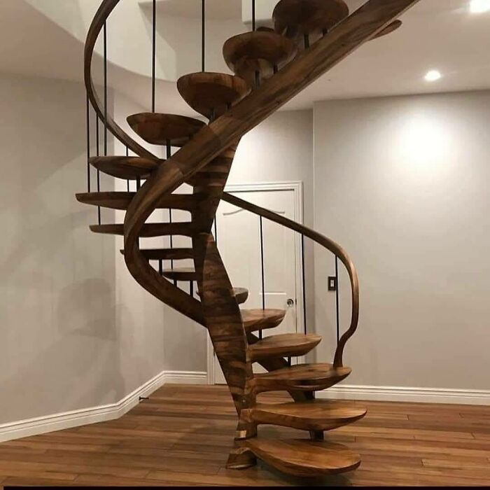 Spiral staircase made from beautifully crafted woodworking projects showcasing impressive wood design and craftsmanship.