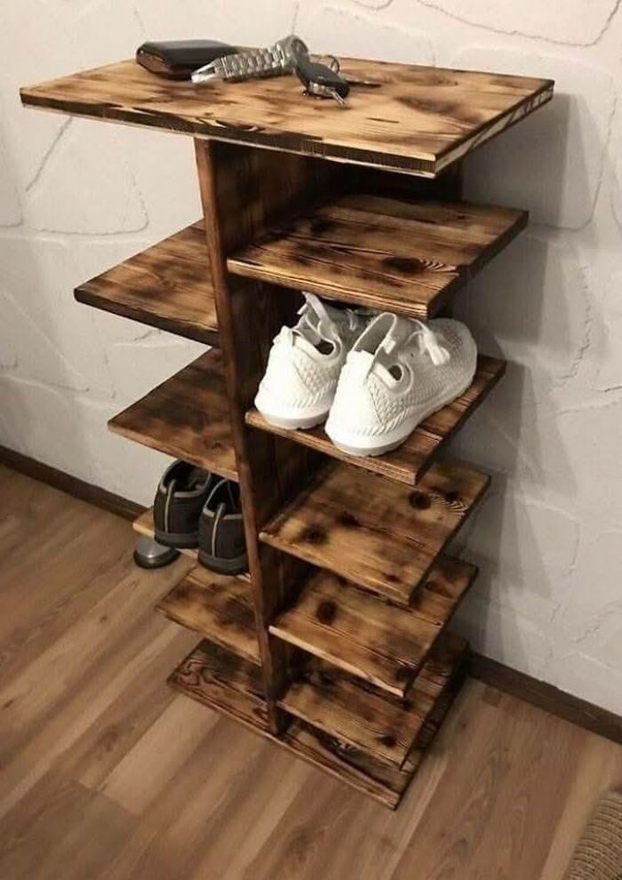 Woodworking project featuring a beautifully crafted multi-level wooden shoe rack with a rustic finish.