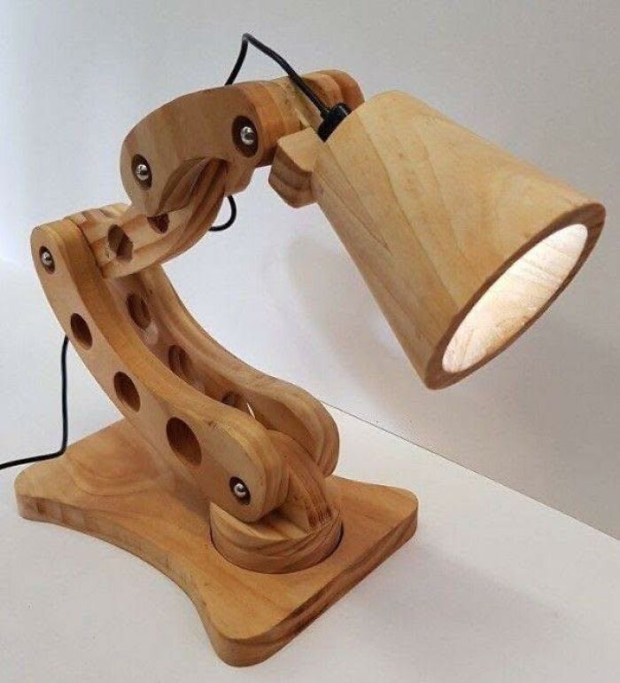 Wooden adjustable desk lamp crafted from smooth wood pieces, showcasing impressive woodworking projects and design details.