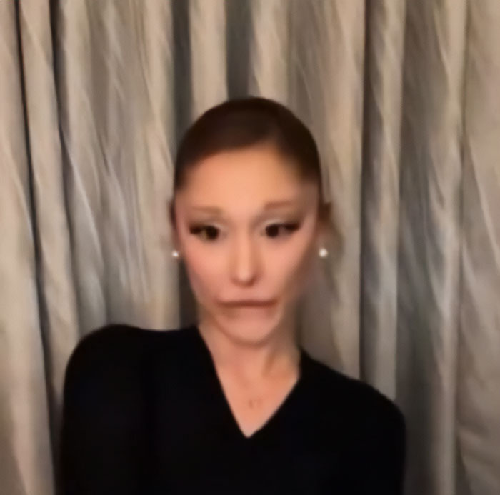 Ariana Grande with unusual facial expression and bizarre mannerisms in a recent interview setting. Ariana Grande with unusual facial expression and bizarre mannerisms in a recent interview setting.