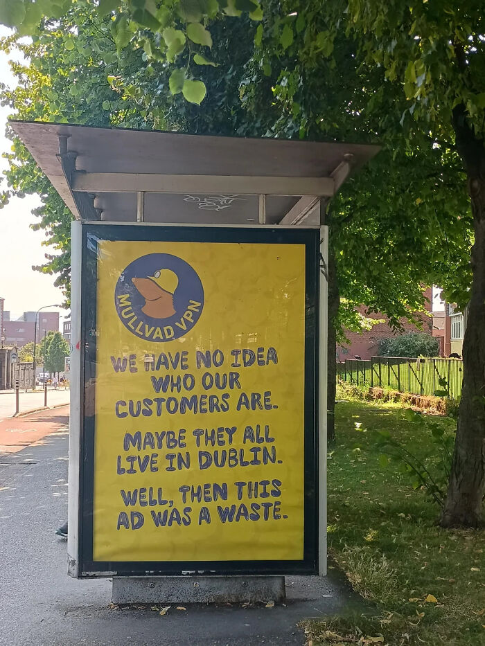 Humorous print advertisement for Mullvad VPN displayed at a bus stop using creativity to engage viewers outdoors.