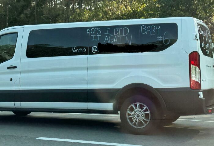 White passenger van with window message Oops I did it again Baby #6 and Venmo handle, an example of next-level jerks