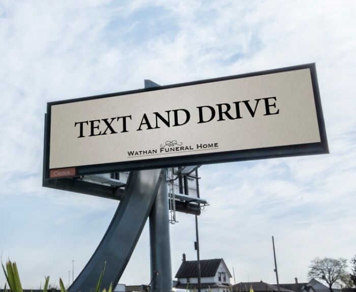 Billboard print advertisement using humor and creativity to warn against texting and driving by a funeral home.