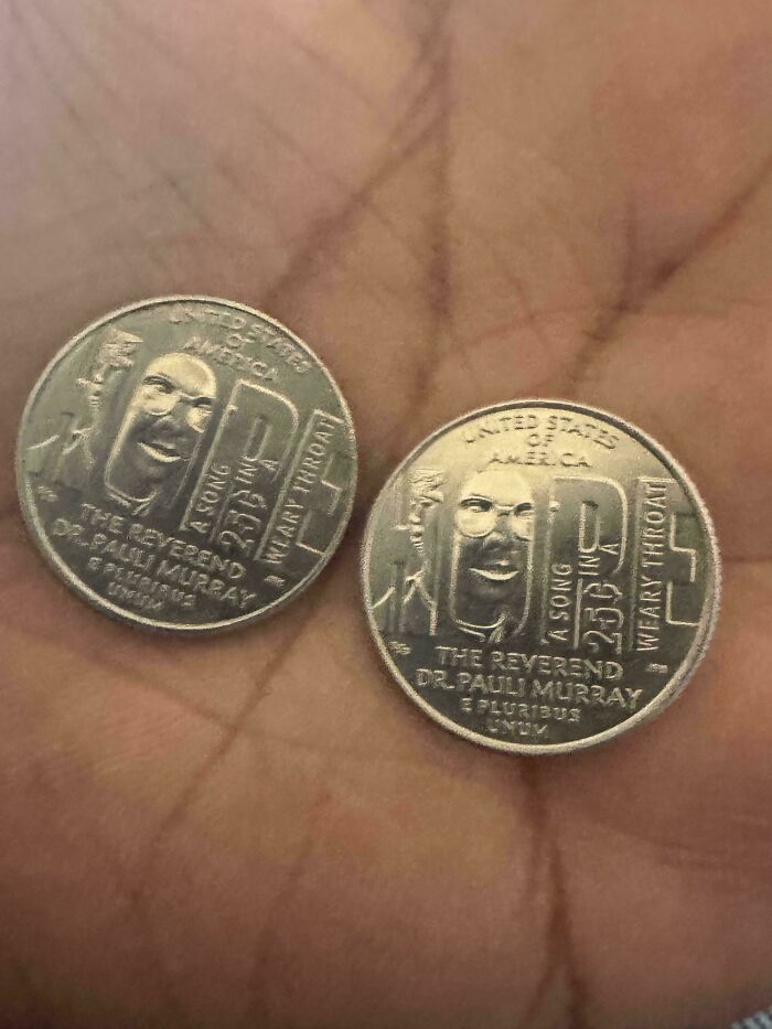 Two identical commemorative coins in an open palm, glitches in the matrix