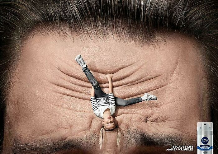 Creative print advertisement showing a girl climbing wrinkles on a forehead, highlighting humor and creativity in ads.