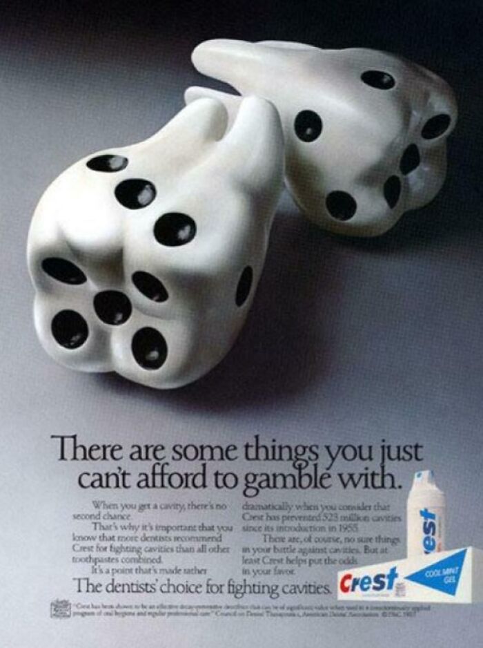 Creative print advertisement showing dice shaped like molar teeth promoting dental care with humor and creativity in print advertisements.