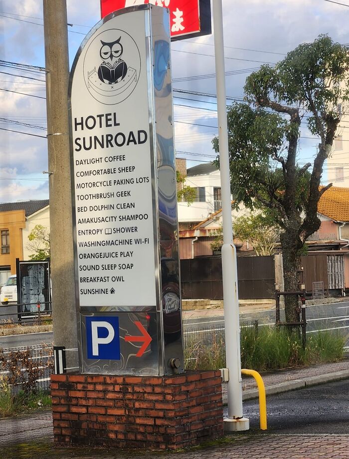 Sign outside Hotel Sunroad in Japan with hilarious English translation errors like toothbrush geek and comfortable sheep.