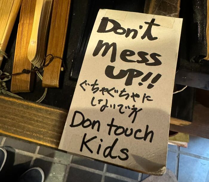Handwritten sign with a funny Japan English translation fail warning not to mess up or don touch kids.