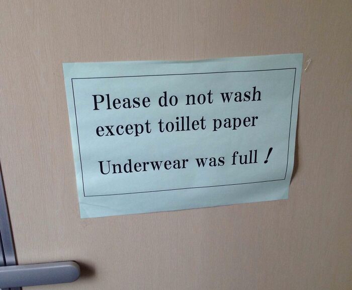 Funny Japan translation fail sign showing incorrect English instructions about washing and underwear warnings.