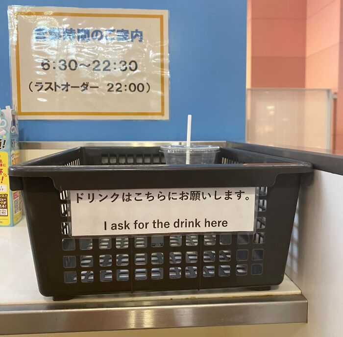 Black basket with a sign saying I ask for the drink here, showcasing Japan getting completely lost while translating to English.