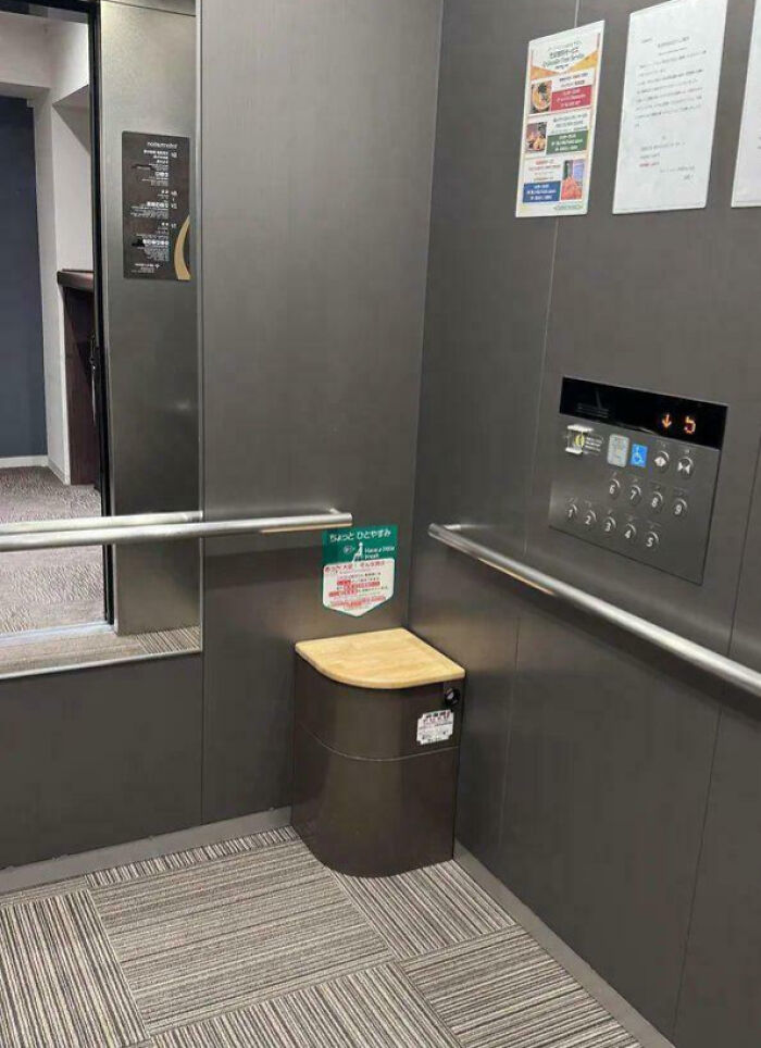 Elevator interior with foldable wooden seat and safety instructions, an impressive thing some countries implemented for comfort and accessibility