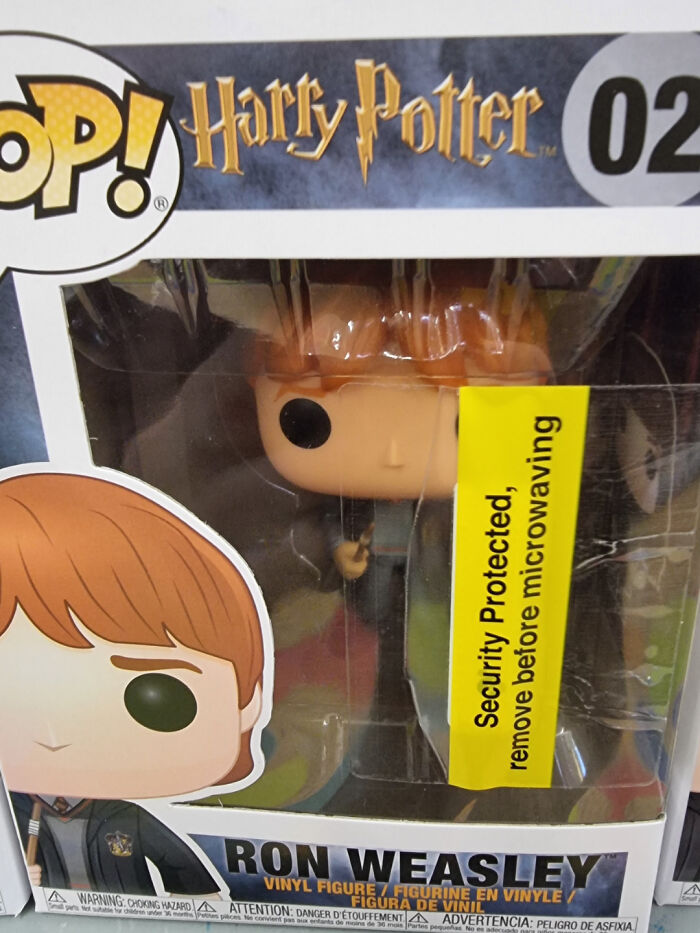 Harry Potter Ron Weasley Funko Pop vinyl figure with security sticker inside clear box packaging.