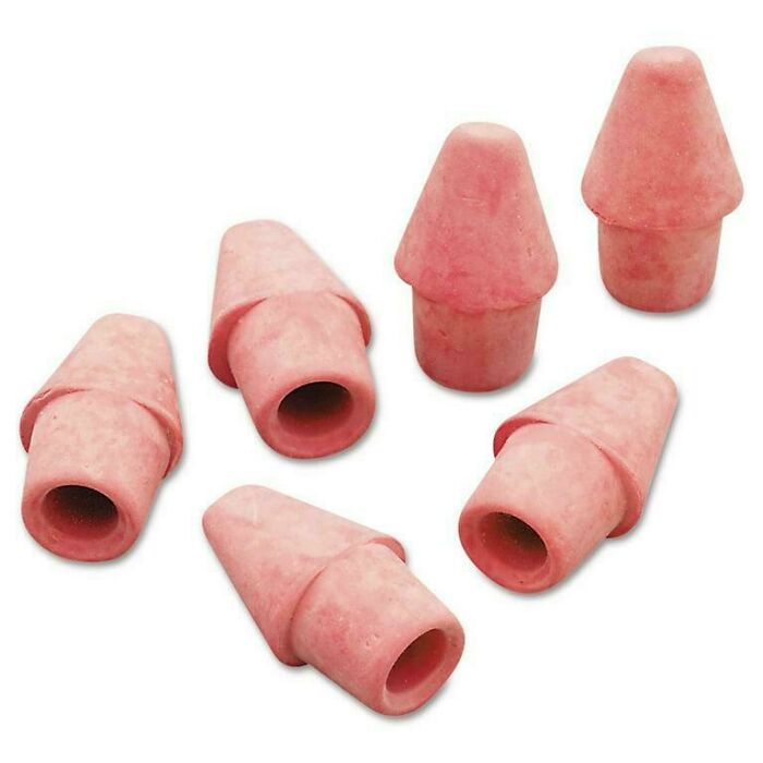 Pink vintage pencil erasers shaped like cones, a nostalgic item to make you feel old as heck from back in the day.