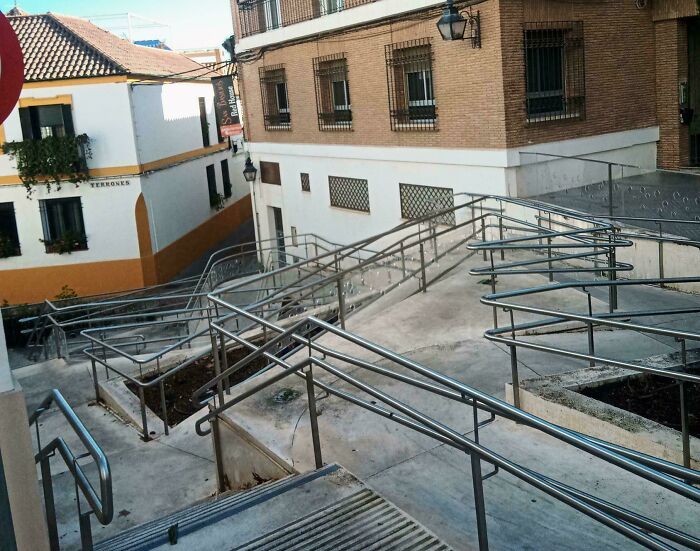 Complex ramp design with excessive railings causing confusion, showcasing designers' dumb decisions and creating problems.