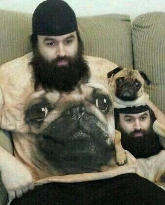 Man and dog wearing matching dog face apparel, creating a random and cringe photo with unique humor and visual effect.
