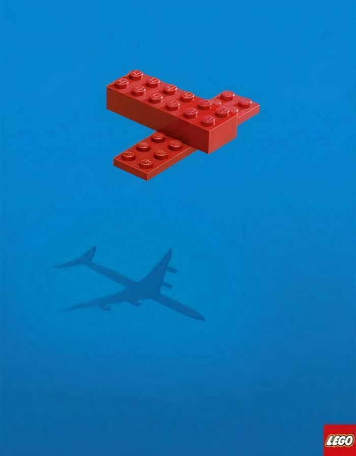 Red LEGO bricks casting a shadow of an airplane over blue background, showcasing creativity in print advertisements.