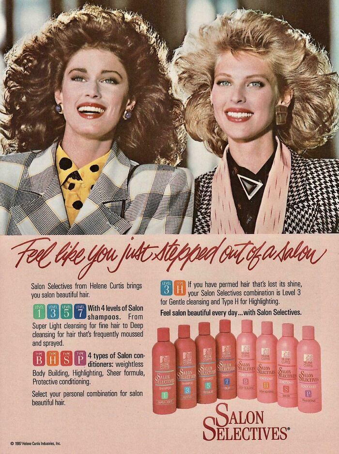 Two women with voluminous hair wearing patterned blazers in a vintage advertisement for Salon Selectives haircare products.