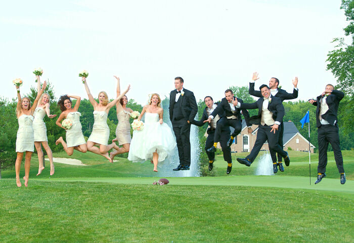 Bride, groom, and wedding party awkwardly jumping mid-air on a golf course in a humorous wedding photo.