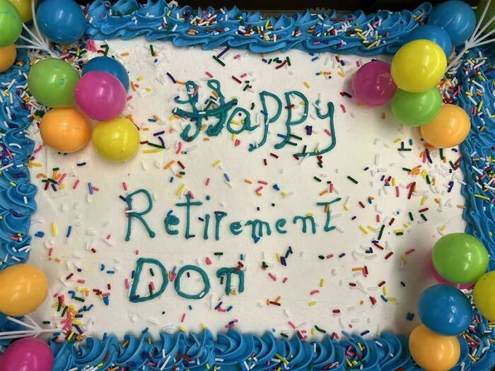 Retirement cake with colorful balloons and sprinkles, decorated with blue icing and a playful handwritten message.