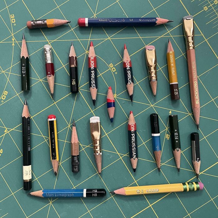 Worn down pencils arranged on a cutting mat showing everyday objects worn down in unexpected ways.