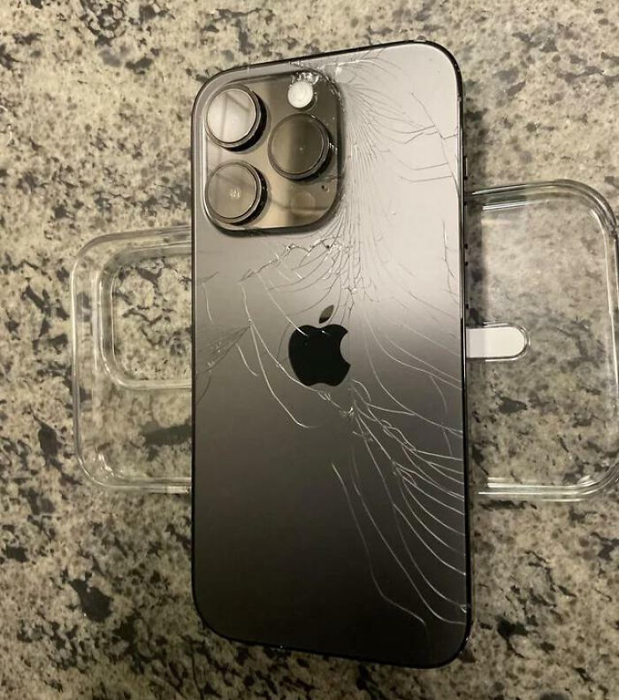 Broken iPhone back glass showing one of the unfortunate and stupid fails that must have been very expensive.