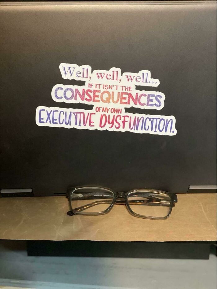 Sticker on a laptop with a quote about executive dysfunction, representing life with a spicy neurodivergent brain.